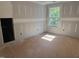 Unfinished room with visible framing, a single window, and prepped drywall, showcasing the potential for customization at 5516 Jaeger Dr # 75, Graham, NC 27253