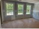 Bare room displaying three windows and unfinished walls, offering a blank canvas ready for personalization and design at 5516 Jaeger Dr # 75, Graham, NC 27253