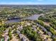 Scenic aerial view of a lakeside community surrounded by lush greenery and picturesque landscapes at 602 Alden Bridge Dr, Cary, NC 27519