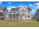 Expansive backyard featuring a screened-in porch and patio, perfect for outdoor entertaining and relaxation at 602 Alden Bridge Dr, Cary, NC 27519