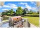 Outdoor grill on the patio, ideal for summer barbecues and enjoying the landscaped backyard at 602 Alden Bridge Dr, Cary, NC 27519