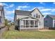 Large backyard features green grass, fenced perimeter, and a screened porch for outdoor living at 602 Alden Bridge Dr, Cary, NC 27519