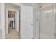 Bathroom showing a glass shower and access to an organized walk-in closet at 602 Alden Bridge Dr, Cary, NC 27519