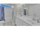 Bright bathroom featuring a double vanity, shower/tub, and neutral finishes at 602 Alden Bridge Dr, Cary, NC 27519
