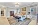 Bright bedroom featuring a chandelier, large rug, and windows providing natural light at 602 Alden Bridge Dr, Cary, NC 27519