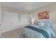 Bright bedroom with comfortable bed, chandelier, and plenty of storage space at 602 Alden Bridge Dr, Cary, NC 27519