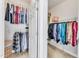 Organized walk-in closet with shelving and hanging racks for ample storage at 602 Alden Bridge Dr, Cary, NC 27519