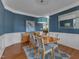 Elegant dining room features wainscoting, modern lighting, and seating for six, perfect for entertaining at 602 Alden Bridge Dr, Cary, NC 27519