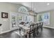 Dining room with many windows and natural light, and access to the outdoor living space at 602 Alden Bridge Dr, Cary, NC 27519
