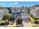 Charming two-story home with a welcoming front porch, well-manicured landscaping, and a two-car garage at 602 Alden Bridge Dr, Cary, NC 27519
