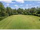 Aerial shot of a community sports field, surrounded by lush greenery, ideal for outdoor activities and recreation at 602 Alden Bridge Dr, Cary, NC 27519