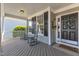 Covered front porch featuring rocking chairs and a 'Home Sweet Home' doormat at 602 Alden Bridge Dr, Cary, NC 27519