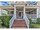 Home's welcoming front porch with white columns and brick steps at 602 Alden Bridge Dr, Cary, NC 27519
