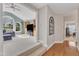 Open floor plan with hardwood floors and carpeted steps leading to living area at 602 Alden Bridge Dr, Cary, NC 27519
