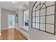 Hallway with hardwood floors leads to the bedroom and living room at 602 Alden Bridge Dr, Cary, NC 27519
