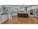 Modern kitchen with stainless steel appliances, island seating, and ample counter space for cooking at 602 Alden Bridge Dr, Cary, NC 27519