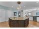 Kitchen with island, granite countertops, pendant lighting, and view to the living areas at 602 Alden Bridge Dr, Cary, NC 27519