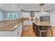 Updated kitchen with granite countertops, stainless steel appliances, tile backsplash and large island at 602 Alden Bridge Dr, Cary, NC 27519