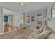 Bright living room featuring a leather sofa, comfortable seating, and hardwood floors at 602 Alden Bridge Dr, Cary, NC 27519