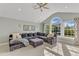 Comfortable living room with vaulted ceiling, a large sectional, and multiple windows at 602 Alden Bridge Dr, Cary, NC 27519
