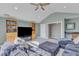 Spacious living room with a large TV, built-in shelving, and vaulted ceilings at 602 Alden Bridge Dr, Cary, NC 27519