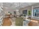Spacious living room with stylish furnishings, coffered ceilings, and ample natural light for gatherings at 602 Alden Bridge Dr, Cary, NC 27519