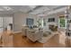Open living area with comfortable seating, coffered ceilings, and large windows, creating a welcoming atmosphere at 602 Alden Bridge Dr, Cary, NC 27519