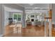 Open-concept living space with coffered ceilings, fireplace, hardwood floors, and abundant natural light at 602 Alden Bridge Dr, Cary, NC 27519