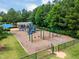 A playground with swings, slides, and climbing structures in a community park at 602 Alden Bridge Dr, Cary, NC 27519