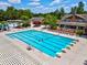 Aerial view of a community pool with lap lanes, leisure pool, and clubhouse amenities at 602 Alden Bridge Dr, Cary, NC 27519