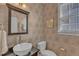 Charming powder room featuring patterned wallpaper, a vessel sink, and decorative mirror at 602 Alden Bridge Dr, Cary, NC 27519