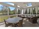 Comfortable screened porch with ample seating, creating an inviting outdoor living space at 602 Alden Bridge Dr, Cary, NC 27519