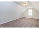 Attic features finished carpet and white walls at 63 Whistling Duck Way, Wendell, NC 27591