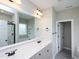 Bathroom showcasing a double vanity with a large mirror, and a separate shower and tub at 63 Whistling Duck Way, Wendell, NC 27591