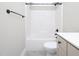 Bathroom features a shower and tub combination with matte black hardware and a light grey vanity at 63 Whistling Duck Way, Wendell, NC 27591