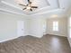 A spacious bedroom featuring plank flooring, a modern ceiling fan, and recessed lighting at 63 Whistling Duck Way, Wendell, NC 27591