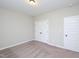 Neutral bedroom with modern carpet, double door closet and natural light at 63 Whistling Duck Way, Wendell, NC 27591