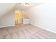 Bonus room with neutral carpet and walls features a view into the bathroom at 63 Whistling Duck Way, Wendell, NC 27591