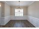 Formal dining area featuring hardwood floors, wainscoting and natural light at 63 Whistling Duck Way, Wendell, NC 27591