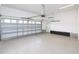Spacious two-car garage with white walls, and epoxy flooring providing ample parking and storage solutions at 63 Whistling Duck Way, Wendell, NC 27591