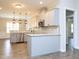 Stylish kitchen with stainless appliances, granite countertops, updated hardware and fixtures at 63 Whistling Duck Way, Wendell, NC 27591