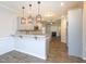 Open kitchen layout with granite countertop, stainless steel appliances, and a clear view to the living room at 63 Whistling Duck Way, Wendell, NC 27591