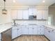Modern kitchen includes stainless steel appliances, granite countertops, and an abundance of storage space at 63 Whistling Duck Way, Wendell, NC 27591
