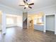 Bright, open space that connects the living area, staircase, dining area, and a modern kitchen at 63 Whistling Duck Way, Wendell, NC 27591