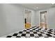 Bright room featuring a black-and-white checkerboard floor, and doorways to other rooms at 6418 Beaver Creek Rd, New Hill, NC 27562