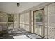 Enclosed porch with lattice details offers a cozy, sunlit space at 6418 Beaver Creek Rd, New Hill, NC 27562