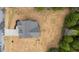 Overhead view of a gray roofed home highlighting its layout, surrounding landscape, and freshly laid lawn at 65 Leisure Ln # 6, Louisburg, NC 27549