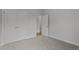 Bedroom with plush carpeting, neutral walls, and double closets provide ample storage space at 65 Leisure Ln # 6, Louisburg, NC 27549