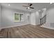 Open living room featuring luxury vinyl flooring, recessed lighting, and a staircase at 65 Leisure Ln # 6, Louisburg, NC 27549