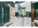 Stylish bathroom featuring green walls, vanity and white cabinets at 6600 Maynard Farm Rd, Chapel Hill, NC 27516